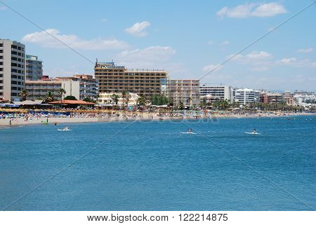 BENALMADENA, SPAIN - JUNE 2, 2008 - People in canoes with views of the beach to the rear Benalmadena Costa del Sol Malaga Province Andalusia Spain Western Europe, June 2, 2008.