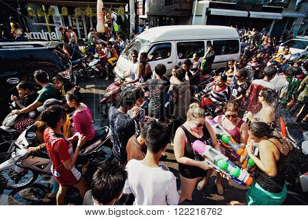 KO SAMUI, THAILAND - APRIL 13: Chaweng Main Road during the celebration of the water fight festival or Songkran Festival (Thai New Year) on April 13, 2014 in Ko Samui island, Thailand.