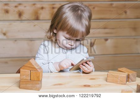 Small Boy With Computer And Phone