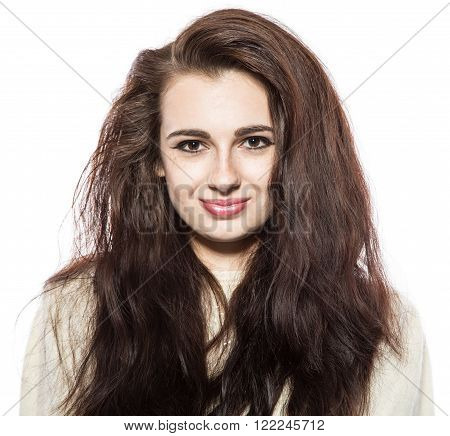 Portrait of smiling beautiful brunette model with freckles and long hair. Isolated on a white background.