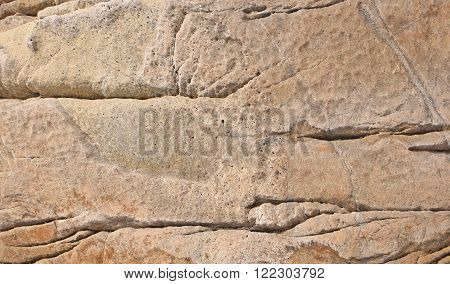 Background of the surface of the stone on the sea shore