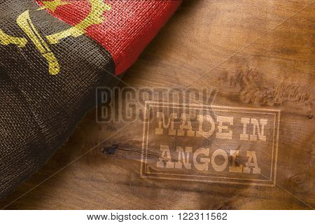 Made in Angola. The national flag of Angola stylized sackcloth.