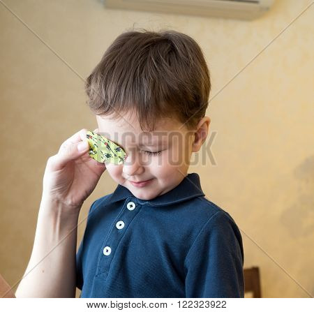 Eye patch. Portrait of a boy. Ophthalmology.