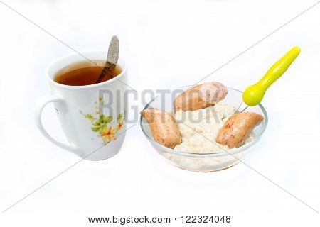 Oatmeal with grilled sausages. Breakfast. Healthy food.