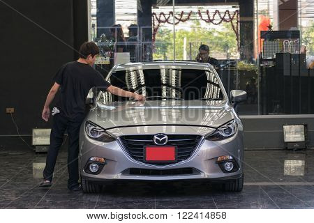 Bangkok, Thailand - May 5, 2016 : Unidentified car care staff cleaning the car (Car detailing).