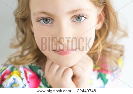 Portrait of beautiful happy little girl with hands