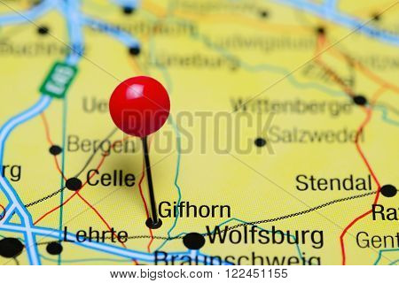 Photo of pinned Gifhorn on a map of Germany. May be used as illustration for traveling theme.