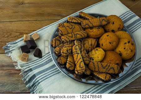 Various chip cookies on a wooden background. Breakfast cookies. Dessert cookies. Cookies. Cookie. Dessert. Breakfast. Sweet cookies. Homemade cookies