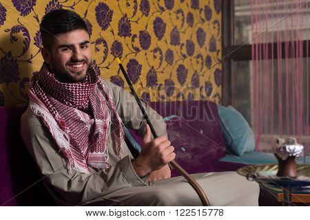 Muslim Man Smoking Shisha At Arabic Restaurant - Exhaling Smoke