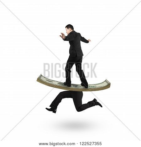 Man balancing on running money with human legs isolated on white background.