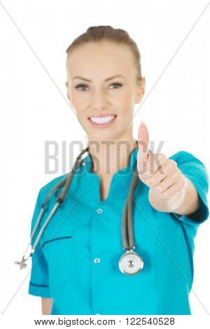 Woman doctor with thumbs up.