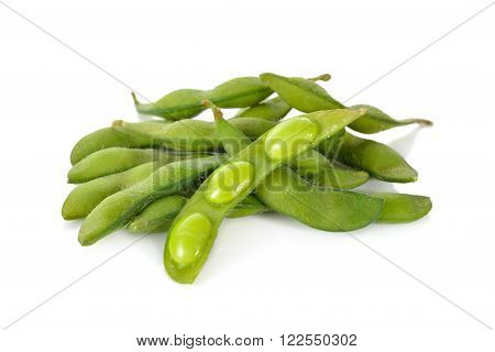 boiled green soybeans with shell on white background