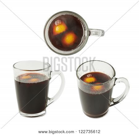 Glass mug filled with mulled wine and orange peels, composition isolated over the white background, set of three different foreshortenings