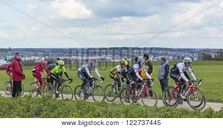 VendomeFrance- March 72016:The peloton riding on a dirty road in Vendome during the first stage of Paris-Nice 2016.