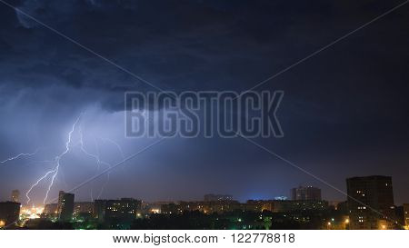 Night sky with lightning over the city Izhevsk