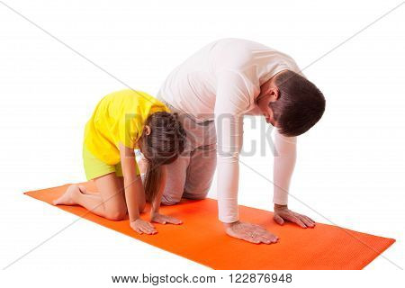 Handsome man father dad practicing yoga with his cute adorable beautiful daughter isolated on white background