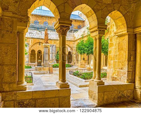 BETHLEHEM PALESTINE - FEBRUARY 18 2016: The view of the Franciscan courtyard with the St. Jerome statue in the middle on February 18 in Bethlehem.