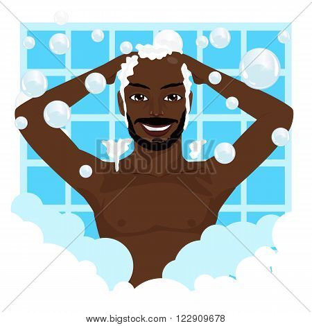 Young happy african american smiling man washing his hair with shampoo