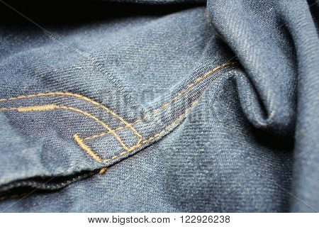 Background or texture of blue torn jeans.