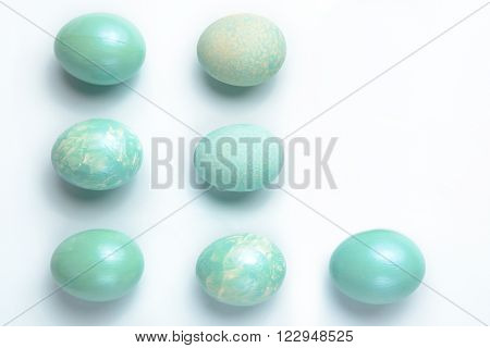 Easter decoration seven turquoise eggs painted with acrylic paint