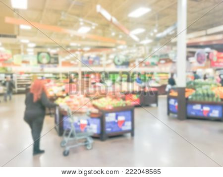 Blurred People Shopping For Fresh Fruits And Vegetables In America