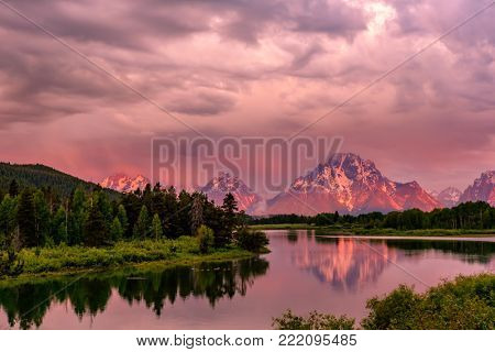 Grand Teton Mountains from Oxbow Bend on the Snake River at sunrise. Grand Teton National Park, Wyoming, USA.