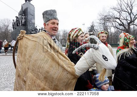 Kharkiv, Ukraine - January 13, 2018 - Participants traditional Christmas of Verteps Parade (nativity Scene), Christmas stars, carols singing. People wearing carnival clothes posing and smiling. Winter outdoor image.