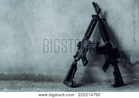 Double assault rifle on gray background, terrorist,robber concept.
