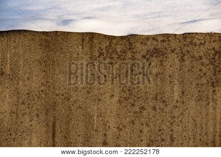 abstract old wall and snow Seasonal background.