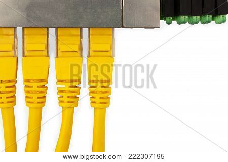 4 yellow UTP patch cords connected in ethernet switch, with top view. Isolated on the white background.