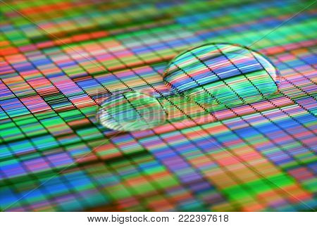 3D Illustration of a method of colored DNA sequencing. Two drops of water on the screen.