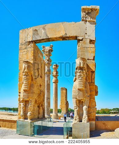 PERSEPOLIS, IRAN - OCTOBER 13, 2017: All Nations Gate (Xerxes Gate) with its preserved statues, decors and columns is one of the most popular landmarks of Persepolis archaeological site, on October 13 in Persepolis.