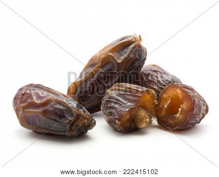 Four date fruits Medjool one cut open isolated on white background