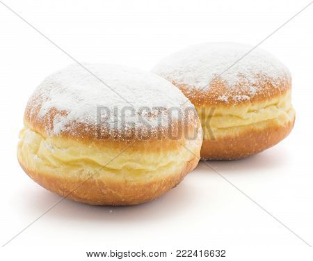 Traditional doughnuts (Sufganiyah) isolated on white background two fresh baked with powered sugar and without hole