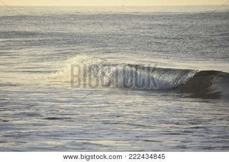 Off the coast of california a beautiful wave crashing
