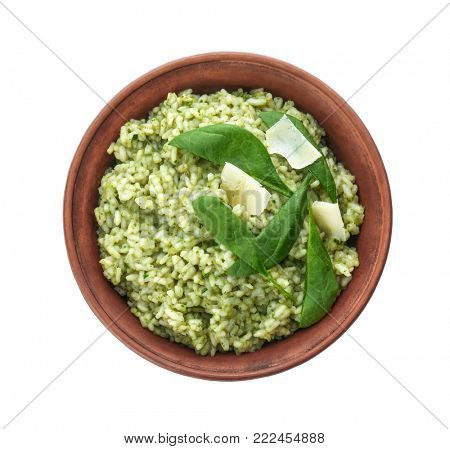 Dish with delicious spinach risotto on white background