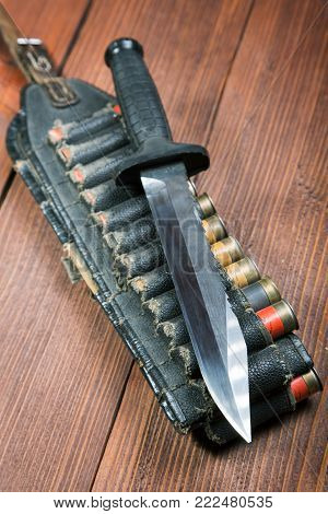 Still Life With A Knife And Bandolier On A Close-up Table