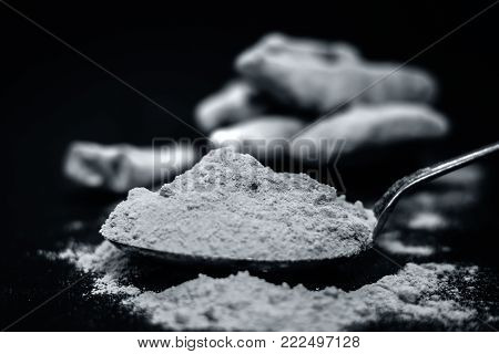 Turmeric,curcuma Longa And Its Powder On A Wooden Surface.;