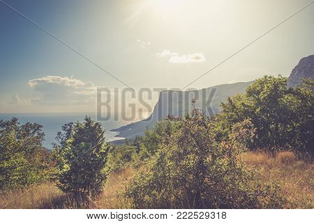Beautiful sunset and sea views on the southern coast of Crimea. View from the foothills of the mountain Ilyas Kaya. Laspi. Nature background. Golden hour.