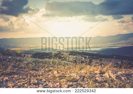 View of the valley Baydarskaya on the southern coast of Crimea. View from the top of the mountain Ilyas Kaya. Golden hour. Enjoyable travel.
