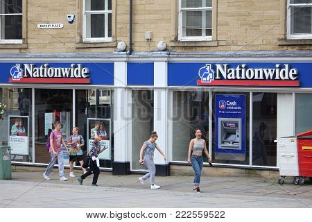 Huddersfield, Uk - July 10, 2016: People Walk By Nationwide Building Society Branch In Huddersfield,
