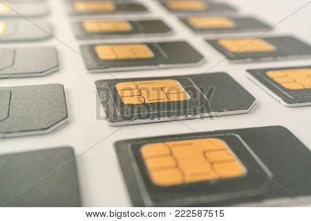 lying in three rows SIM cards, a variety of cards