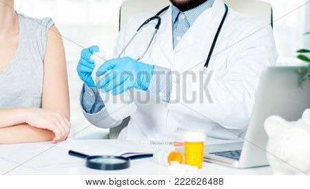 Vaccination. Flu shot. Doctor with syringe making vaccination to patient.  Doctor making an injection to girl
