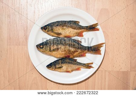 Small Fried river fish on the plate