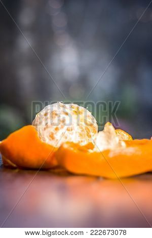 Close Up Of Fresh Ripe Oranges,citrus Aurantium Without Peel On Wooden Surface.;
