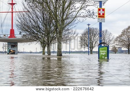 DUISBURG , GERMANY - JANUARY 08 2017 : The river Rhine is flooding the Muehlenweide in Ruhrort