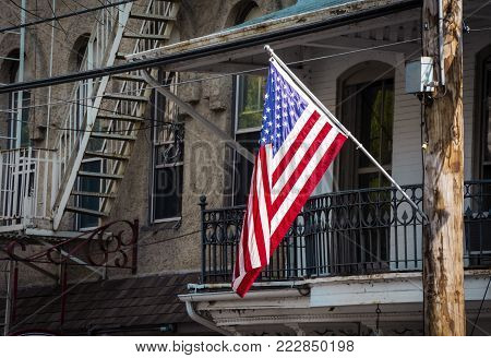 An American flag against some old architecture in Lambertville NJ.