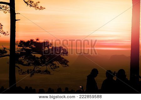 People watching Sunrise in the morning. Tourists travel relax in the holiday. photograph sunrise in the morning among people. Thailand