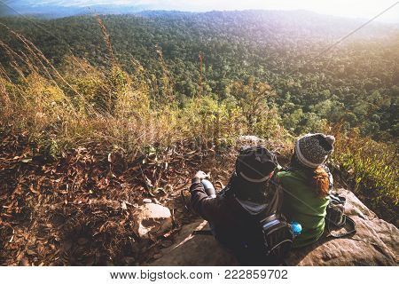 Lover women and men asians travel relax in the holiday. Admire the atmosphere landscape on the Moutain. Mountain Park happily. In Thailand