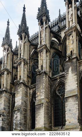 Travel to France - view of towers of Reims Cathedral (Notre-Dame de Reims) in summer evening from rue Robert de Coucy